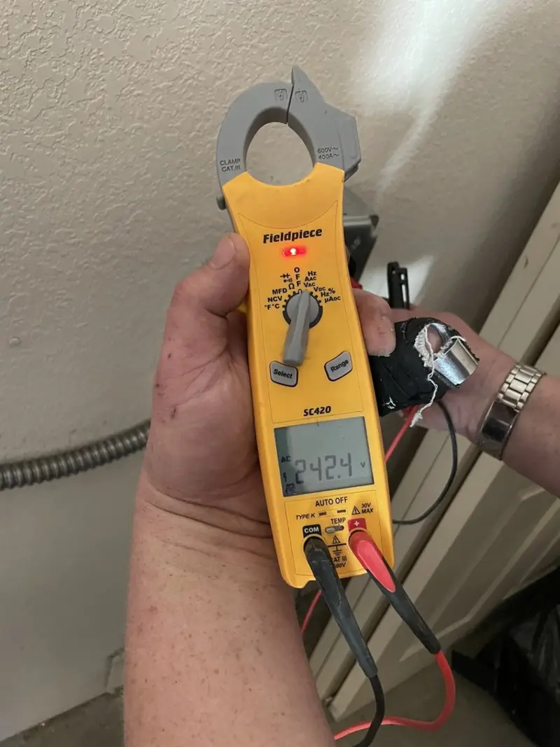 Voltage testing with clamp meter during Generator Installation in Avon